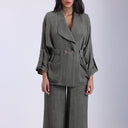 Olive green linen set with oversized jacket and matching wide-leg pants.